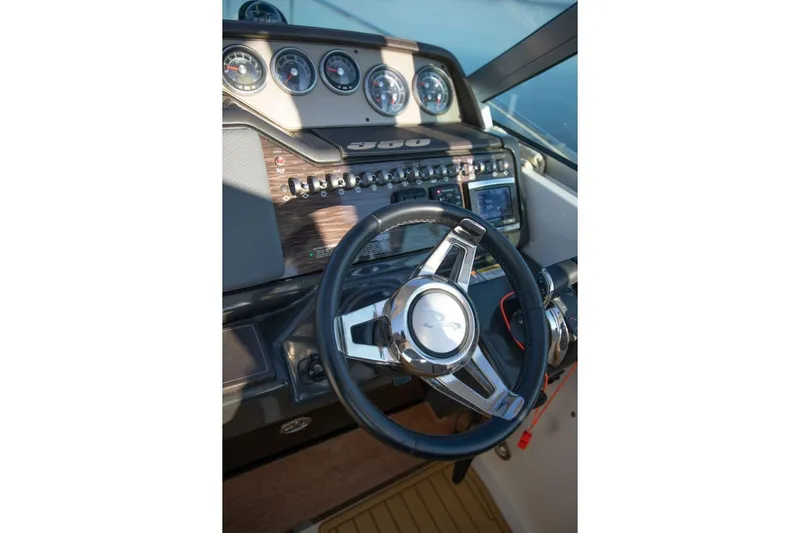  Yacht Photos Pics Steering wheel and dashboard of 2016 Sea Ray 350 Sundancer boat.