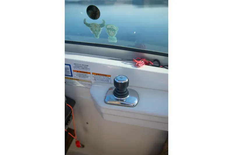  Yacht Photos Pics Control knob on 2016 Sea Ray 350 Sundancer boat dashboard with stickers and warning labels.