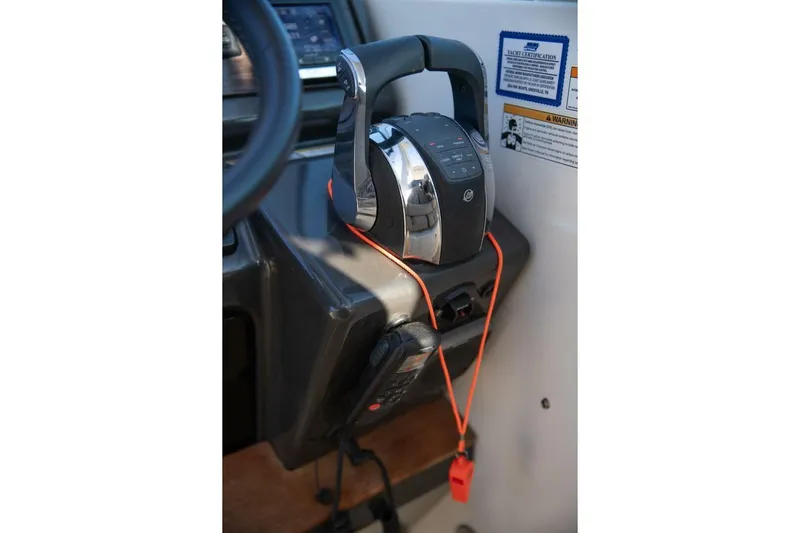  Yacht Photos Pics Control panel of 2016 Sea Ray 350 Sundancer boat with throttle and safety lanyard.