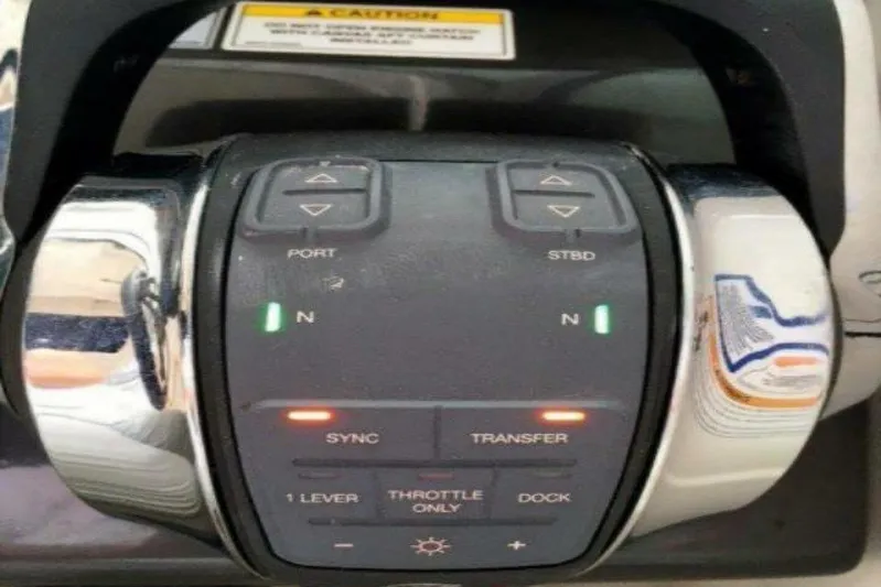  Yacht Photos Pics Control panel of a 2016 Sea Ray 350 Sundancer boat, featuring throttle and navigation controls.