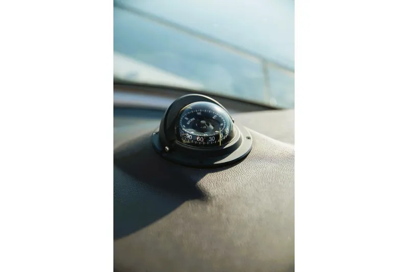  Yacht Photos Pics Compass on 2016 Sea Ray 350 Sundancer dashboard, close-up view.