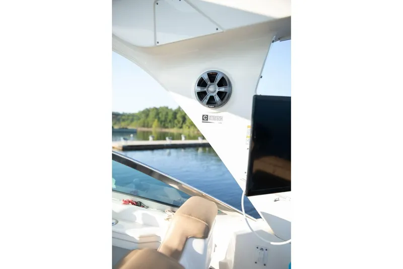  Yacht Photos Pics Interior view of 2016 Sea Ray 350 Sundancer boat with speaker and water backdrop.