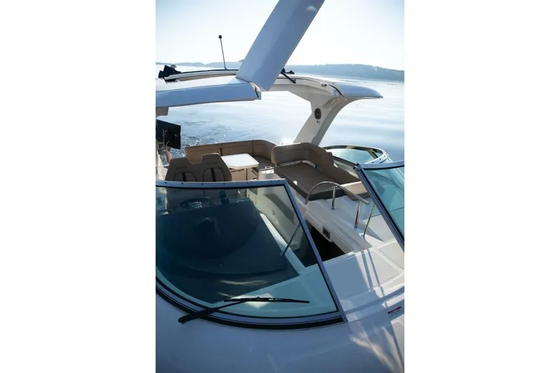  Yacht Photos Pics 2016 Sea Ray 350 Sundancer boat with open deck and seating area on calm water.