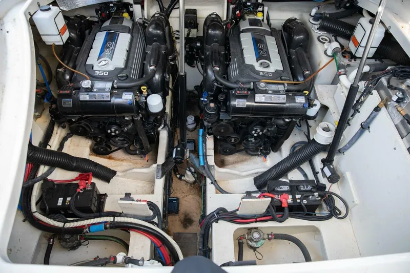  Yacht Photos Pics Engine compartment of a 2016 Sea Ray 350 Sundancer, featuring dual engines and wiring.