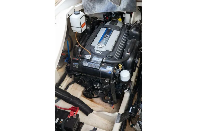  Yacht Photos Pics Engine compartment of 2016 Sea Ray 350 Sundancer boat, showcasing detailed mechanics.