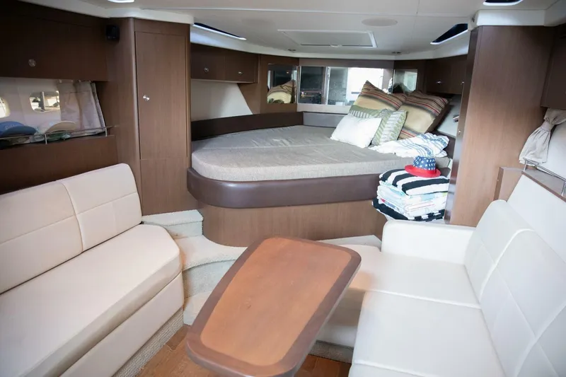  Yacht Photos Pics Interior of 2016 Sea Ray 350 Sundancer yacht with cozy seating and bed.