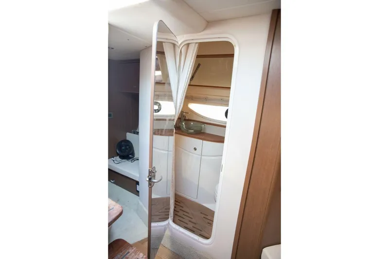  Yacht Photos Pics Interior of 2016 Sea Ray 350 Sundancer yacht, featuring a compact bathroom and seating area.