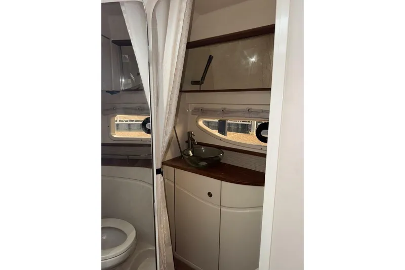  Yacht Photos Pics Interior of 2016 Sea Ray 350 Sundancer bathroom with sink and toilet.