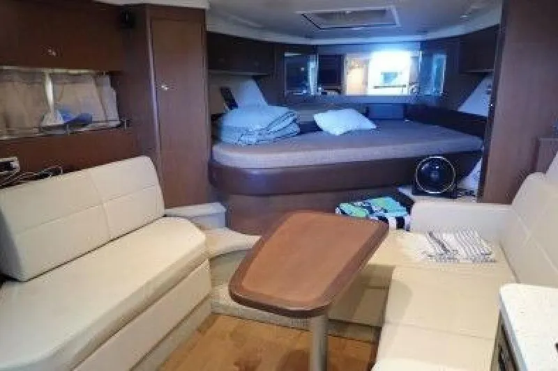  Yacht Photos Pics Interior of 2016 Sea Ray 350 Sundancer yacht with cozy seating and bed.