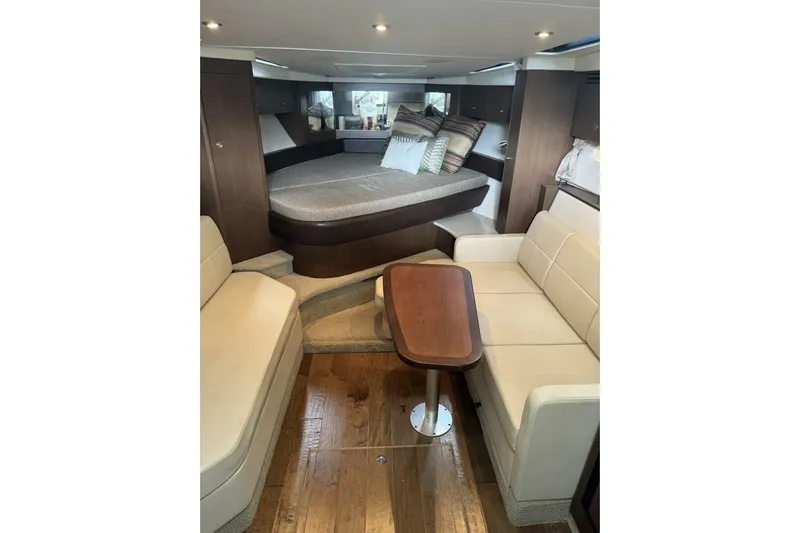  Yacht Photos Pics Interior of 2016 Sea Ray 350 Sundancer yacht with cozy seating and elegant wood finishes.