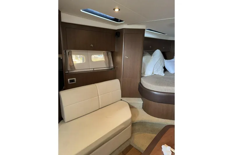  Yacht Photos Pics Interior of 2016 Sea Ray 350 Sundancer yacht with seating and bed.