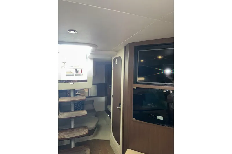  Yacht Photos Pics Interior of 2016 Sea Ray 350 Sundancer yacht with modern amenities and wooden accents.