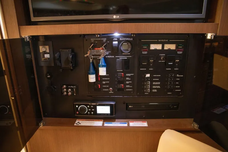  Yacht Photos Pics Control panel of a 2016 Sea Ray 350 Sundancer yacht, featuring various switches and gauges.