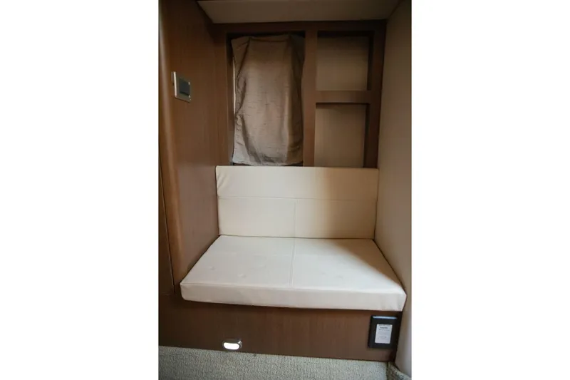  Yacht Photos Pics Interior seating area of 2016 Sea Ray 350 Sundancer yacht, featuring cushioned bench.