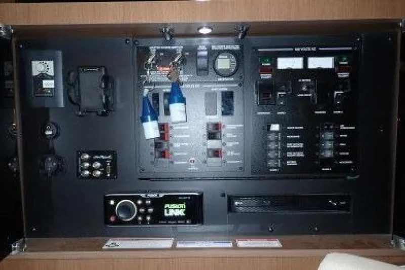  Yacht Photos Pics Control panel of a 2016 Sea Ray 350 Sundancer boat with various switches and displays.