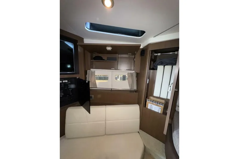  Yacht Photos Pics Interior of 2016 Sea Ray 350 Sundancer with modern seating and storage.