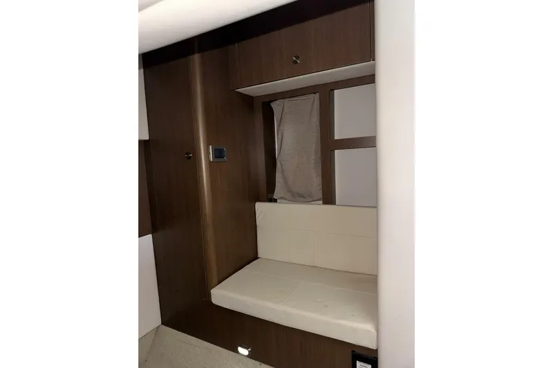  Yacht Photos Pics 2016 Sea Ray 350 Sundancer interior with wooden paneling and cushioned seating.