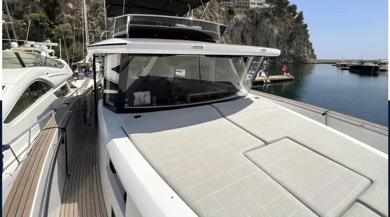  Yacht Photos Pics Pardo Yachts E60 2021 model docked, showcasing sleek design and spacious deck.