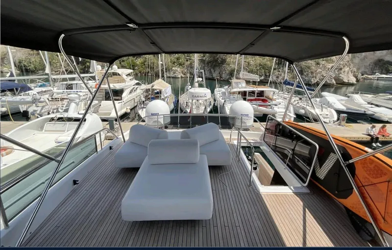  Yacht Photos Pics Luxurious 2021 Pardo Yachts E60 with spacious deck and modern seating in a marina.
