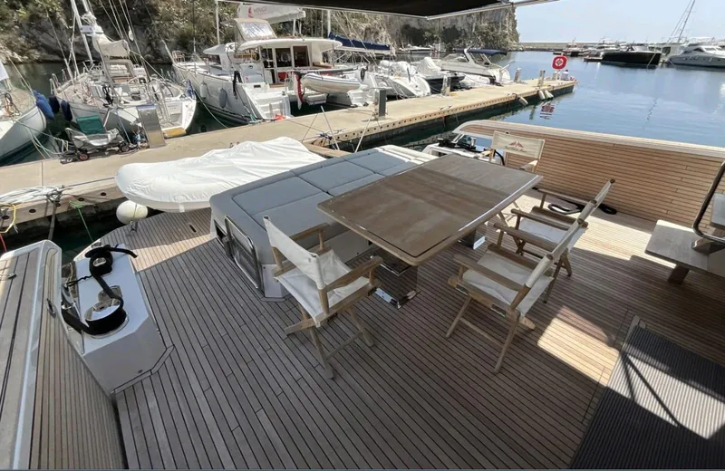 Yacht Photos Pics Luxury deck of 2021 Pardo Yachts E60, featuring elegant seating and table setup.