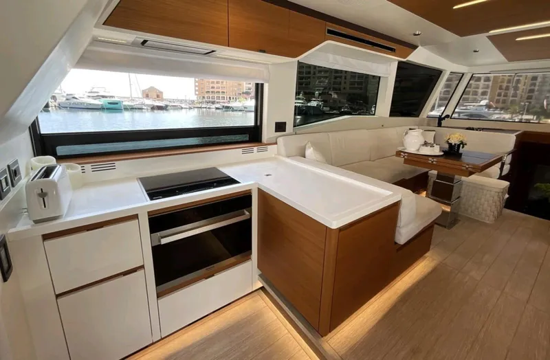  Yacht Photos Pics Luxurious interior of 2021 Pardo Yachts E60 with modern kitchen and seating area.