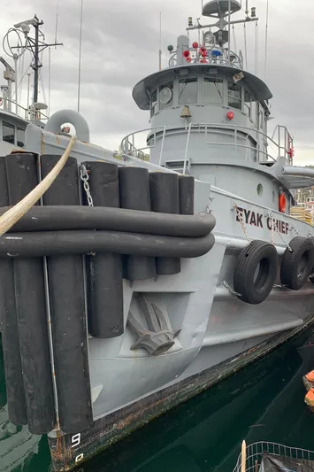 Yacht Photos Pics 1955 L-T 100 Steel Army Tugboat docked, featuring robust design and fendering.
