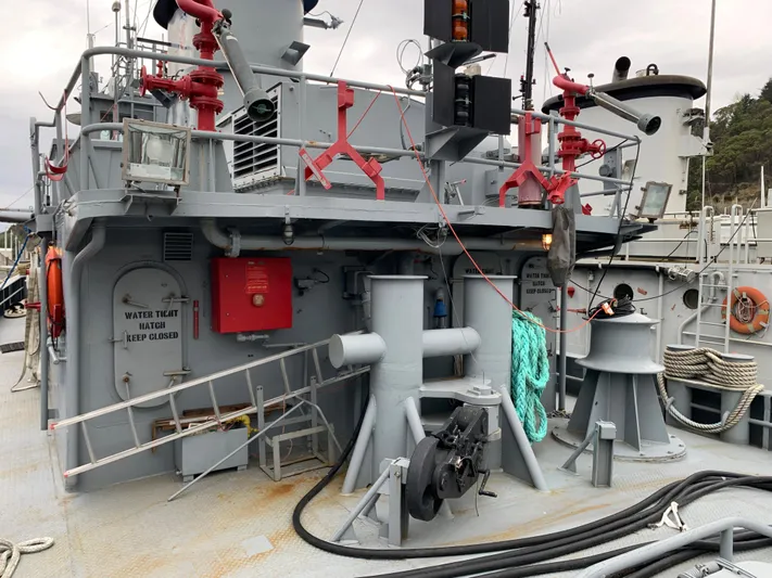  Yacht Photos Pics 1955 L-T 100 Steel Army Tugboat deck with equipment and safety features.