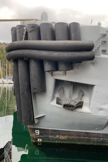  Yacht Photos Pics 1955 Tugboat L-T 100 Steel Army Tug with rubber fenders in harbor.
