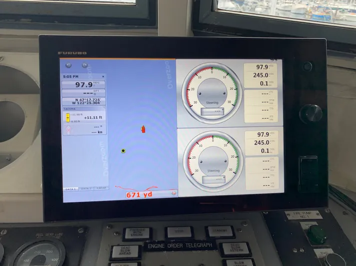 Yacht Photos Pics Control panel of a 1955 Tugboat L-T 100 Steel Army Tug, displaying navigation data.