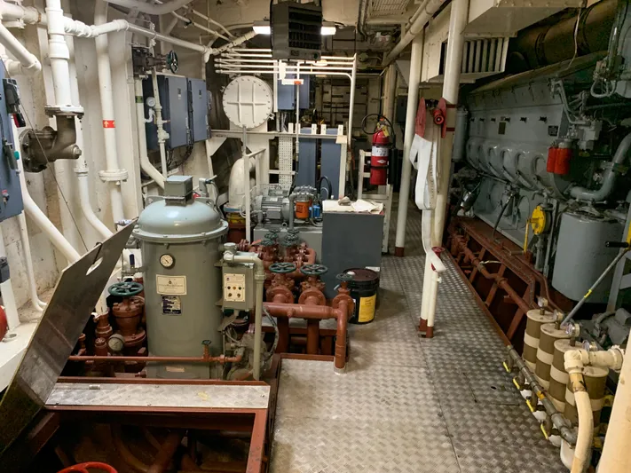  Yacht Photos Pics Engine room of 1955 L-T 100 Steel Army Tugboat with machinery and control panels.