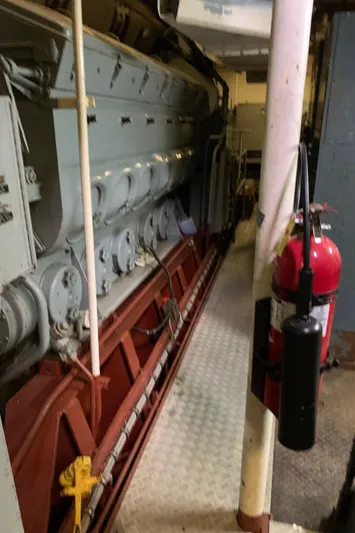  Yacht Photos Pics Engine room of 1955 Tugboat L-T 100 Steel Army Tug with fire extinguisher.