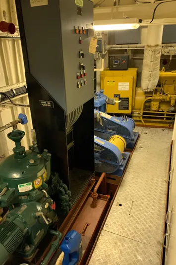  Yacht Photos Pics Engine room of 1955 Tugboat L-T 100 Steel Army Tug with machinery and control panels.