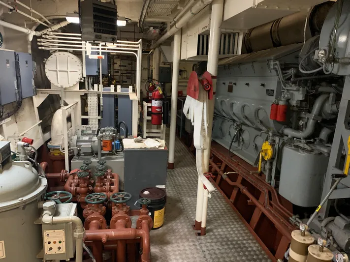  Yacht Photos Pics Engine room of 1955 Tugboat L-T 100 Steel Army Tug, featuring machinery and control panels.
