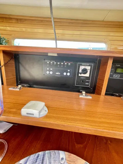  Yacht Photos Pics Control panel inside a 2017 Catalina 425 yacht, featuring wooden cabinetry.