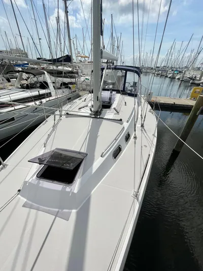  Yacht Photos Pics 2017 Catalina 425 sailboat docked in marina, surrounded by other boats under a partly cloudy sky.