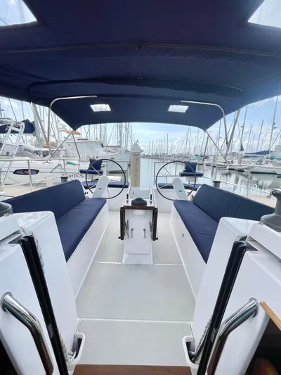  Yacht Photos Pics Interior view of a 2017 Catalina 425 sailboat with blue seating and canopy.