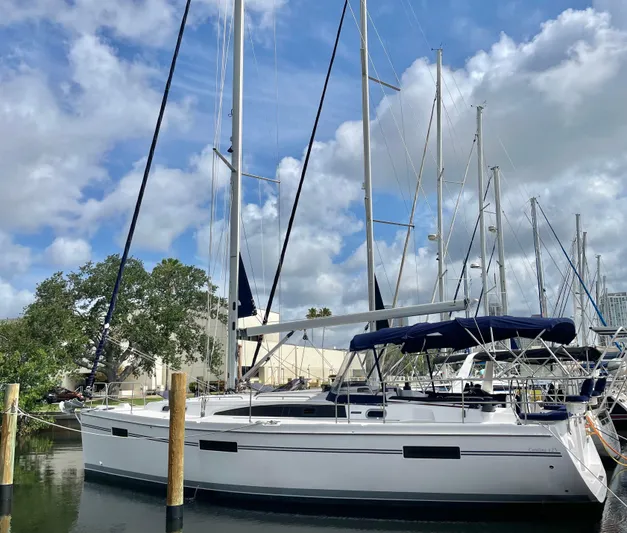  Yacht Photos Pics 2017 Catalina 425 sailboat docked under a blue sky with clouds.