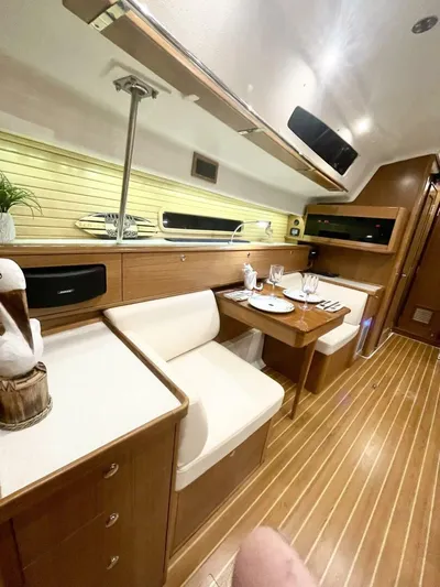  Yacht Photos Pics Interior of 2017 Catalina 425 yacht with elegant dining area and wooden flooring.