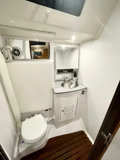  Yacht Photos Pics 2017 Catalina 425 yacht bathroom with modern fixtures and wooden floor accents.