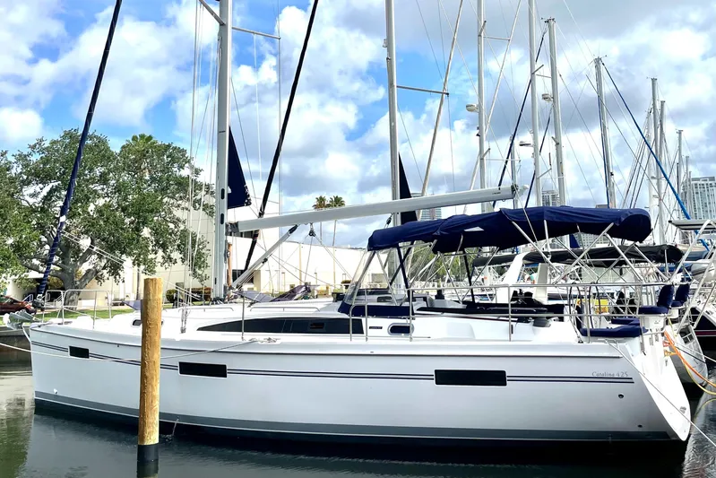  Yacht Photos Pics 2017 Catalina 425 sailboat docked in marina, featuring sleek design and blue canopy.