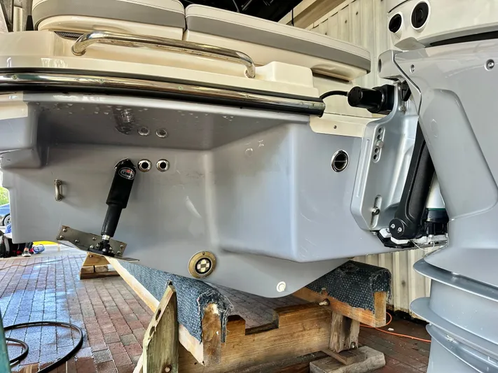  Yacht Photos Pics Rear view of a 2024 Sea Ray 260 SLX OB boat on a stand.