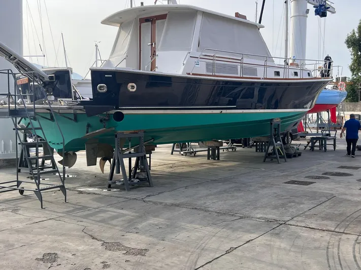  Yacht Photos Pics 2004 Grand Banks Eastbay 54 SX yacht on dry dock for maintenance.