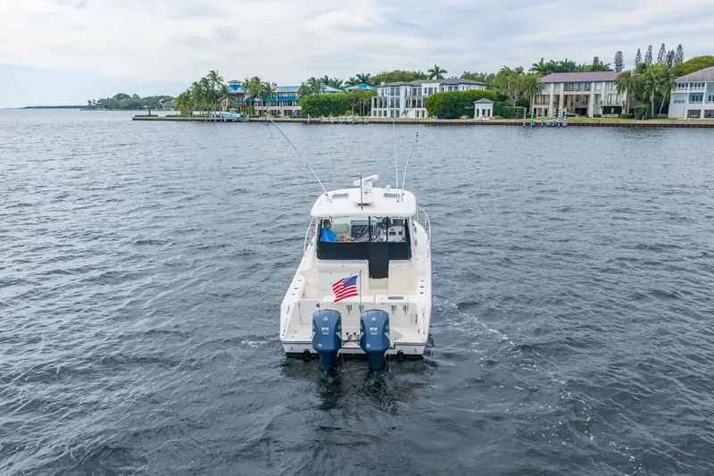  Yacht Photos Pics 2012 Pursuit OS 345 Offshore boat on calm waters.