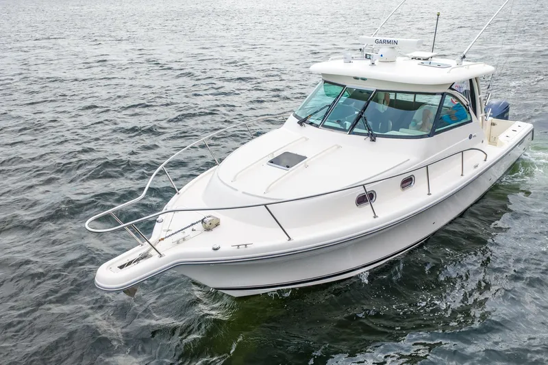  Yacht Photos Pics 2012 Pursuit OS 345 Offshore boat on calm water.