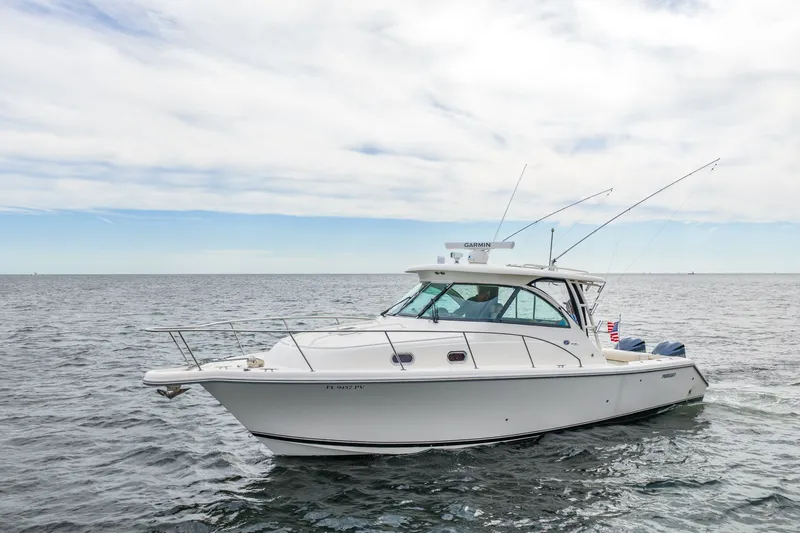  Yacht Photos Pics 2012 Pursuit OS 345 Offshore boat on open sea.