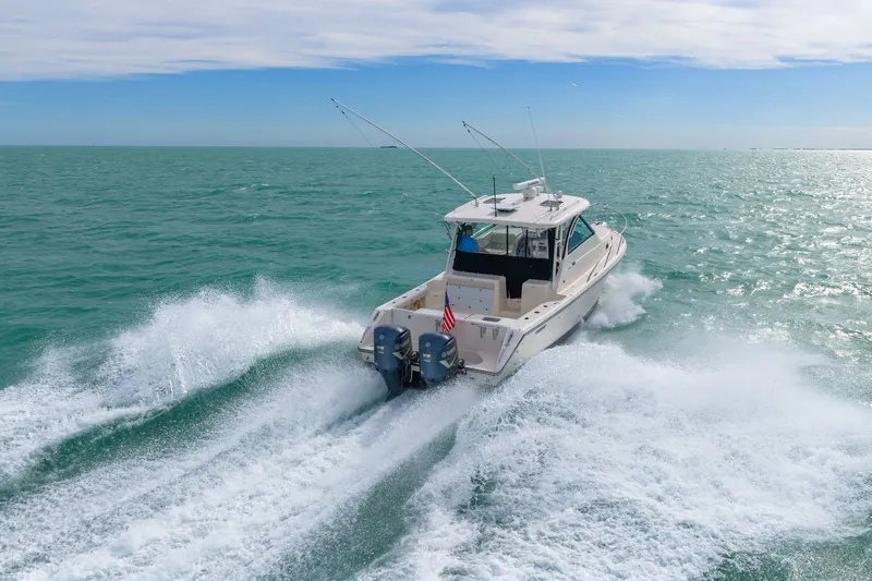  Yacht Photos Pics Pursuit OS 345 Offshore 2012 cruising on open sea.