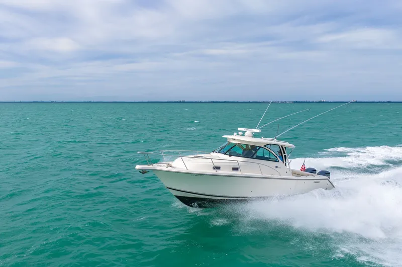  Yacht Photos Pics 2012 Pursuit OS 345 Offshore cruising on open sea.
