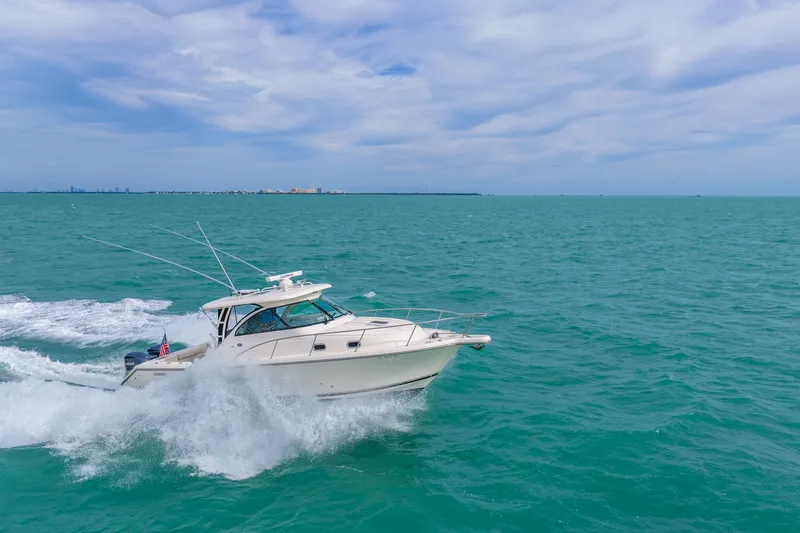  Yacht Photos Pics 2012 Pursuit OS 345 Offshore cruising on open sea.