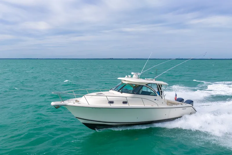  Yacht Photos Pics 2012 Pursuit OS 345 Offshore cruising on open sea.