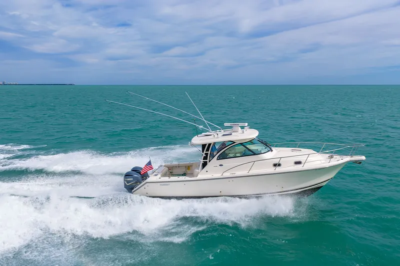  Yacht Photos Pics 2012 Pursuit OS 345 Offshore cruising on open sea.